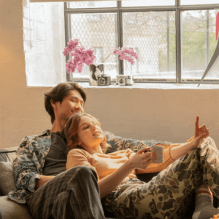 Couple on a sofa watching TV